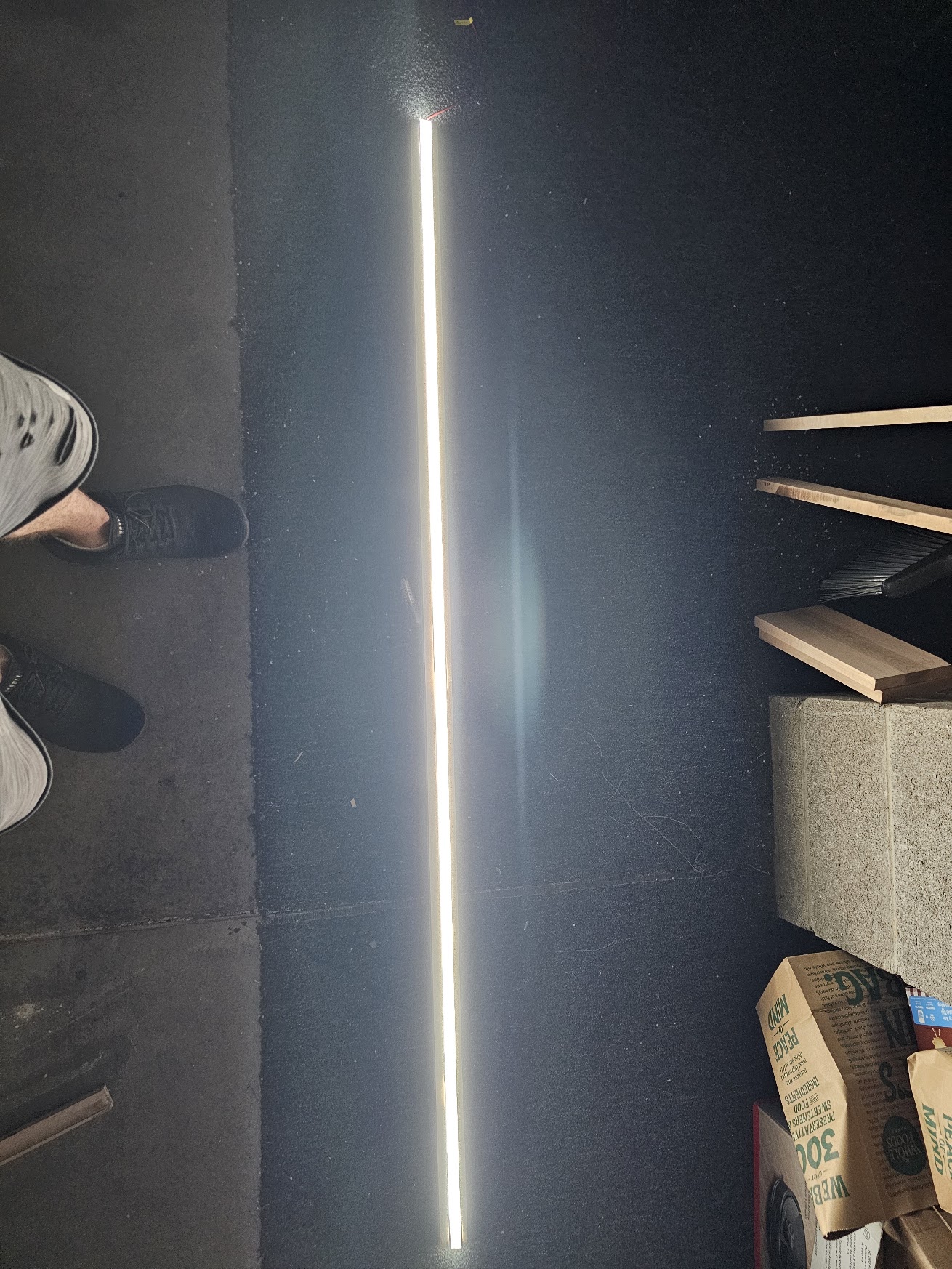 The finished light channel glowing as a smooth continuous line in a dark garage